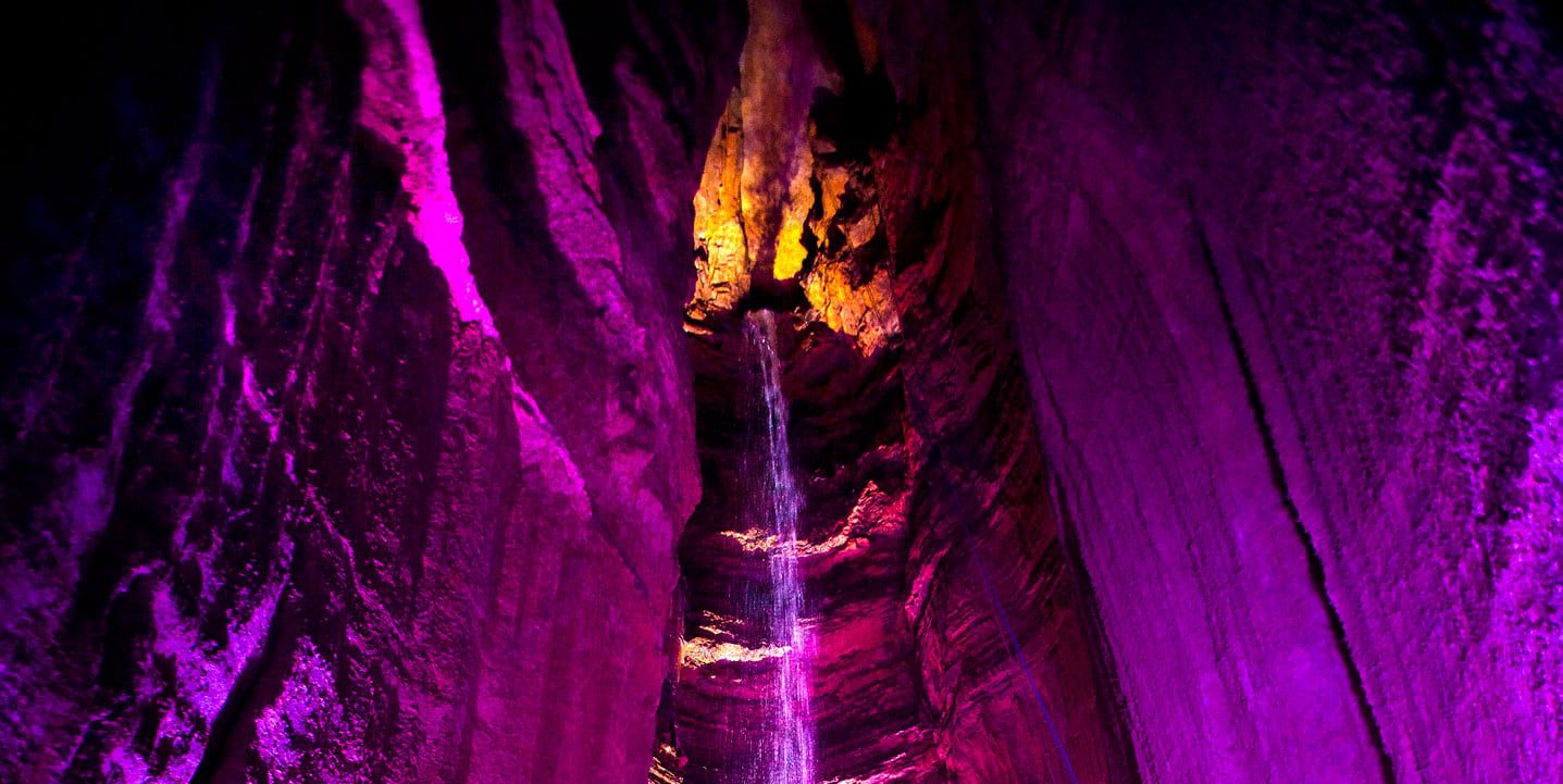 Ruby Falls lit a pinkish purple