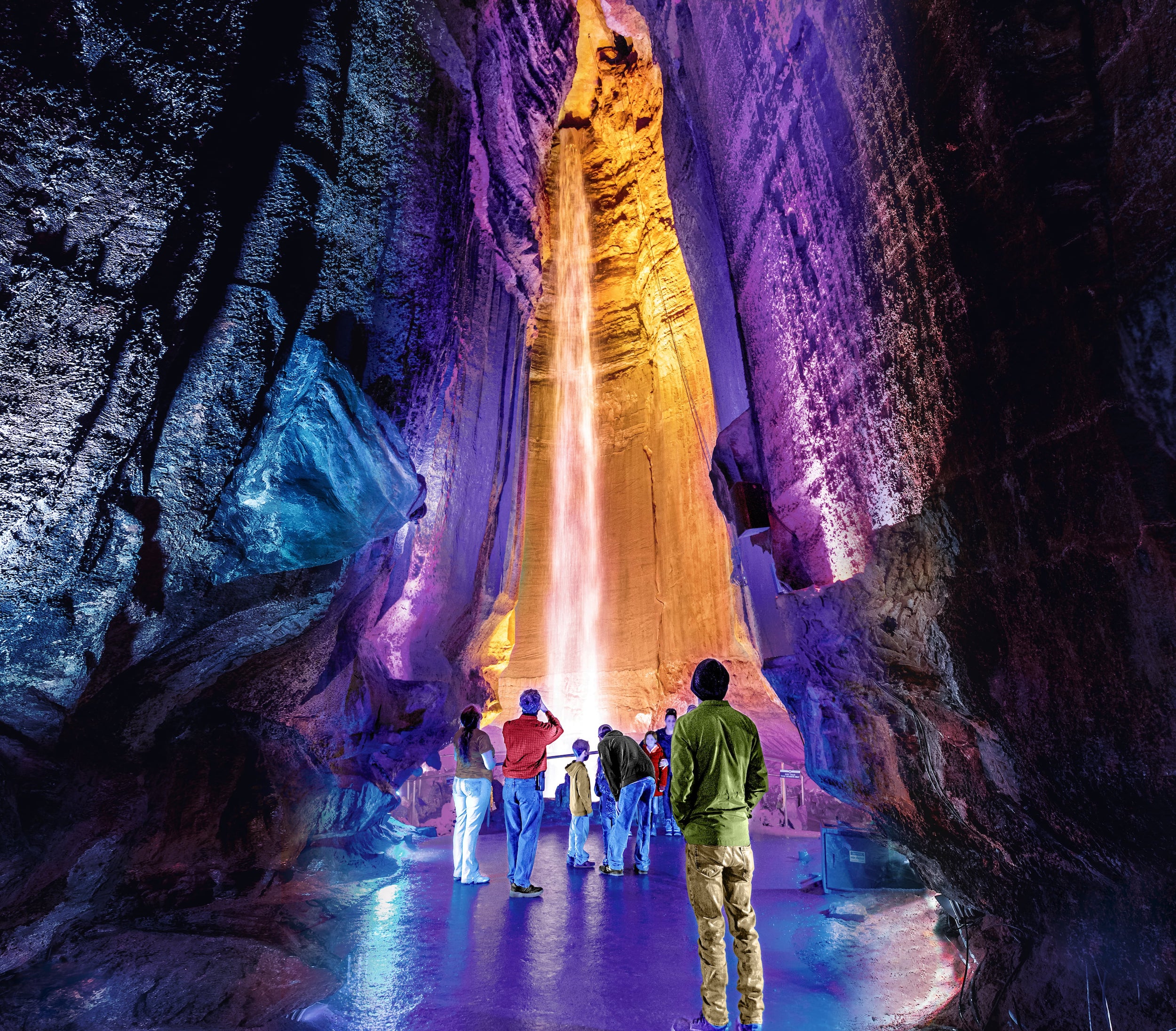 A group of people look at Ruby Falls