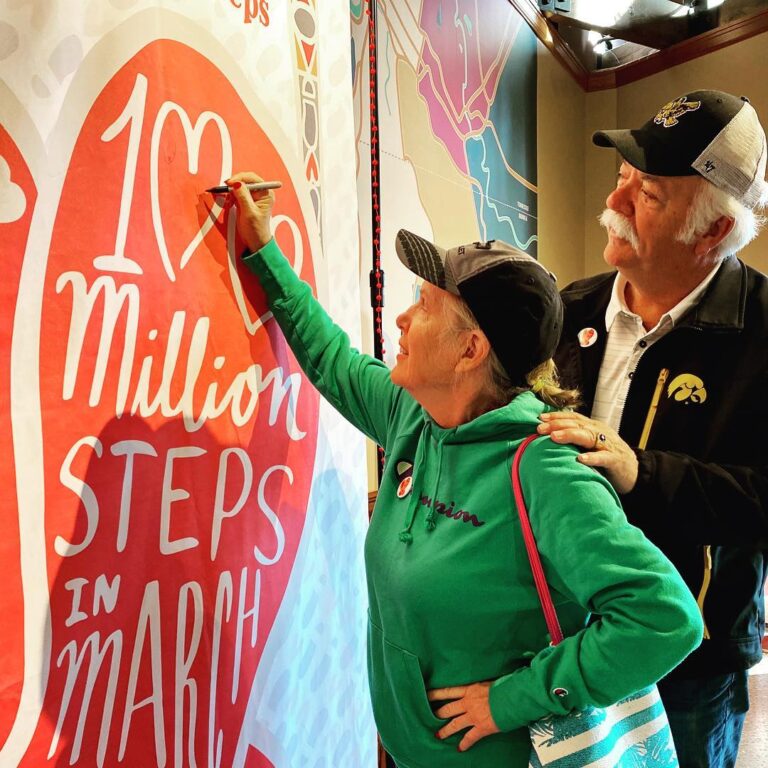 Guest signing a banner for 100 million steps