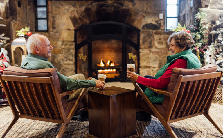 Older couple in front of the fireplace