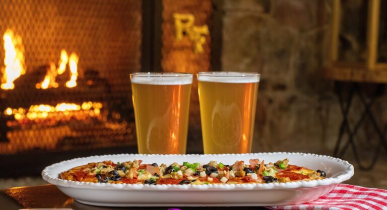Two pints of beer and a plate of food at Ruby Falls Cafe