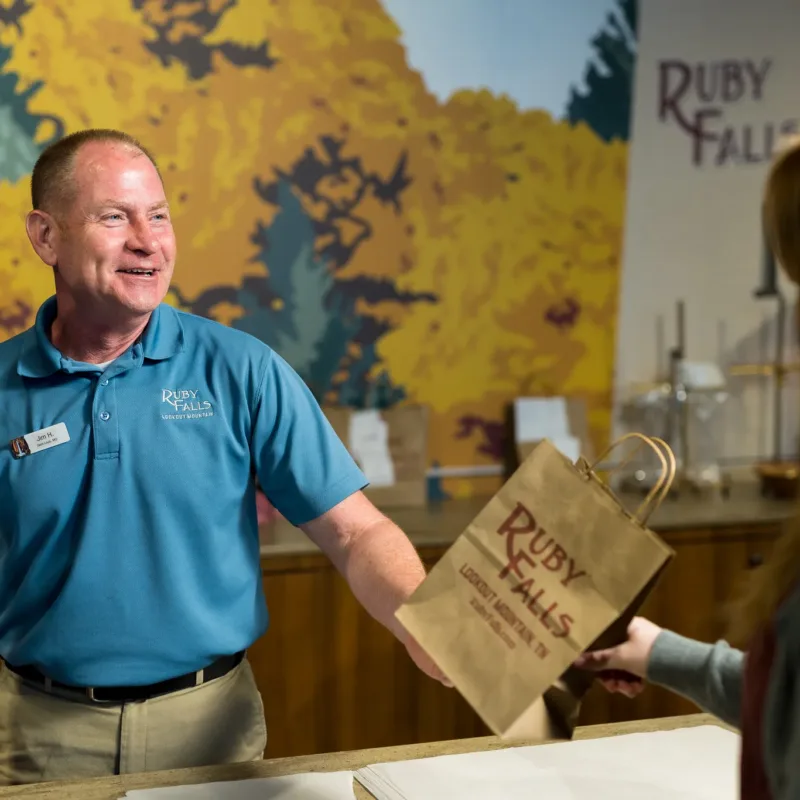 Male employee working at the Ruby Falls gift shop 