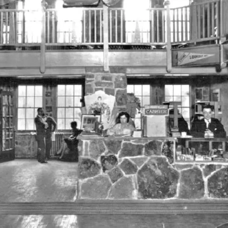 Black and white photo of people working at the Ruby Falls Castle cash register 
