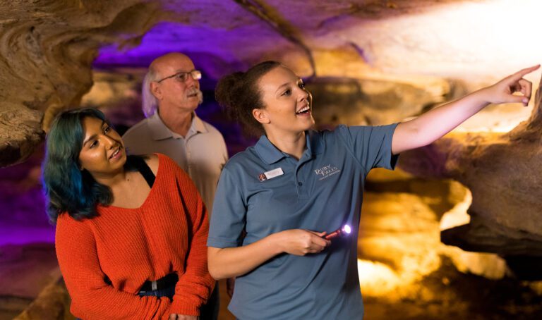 A couple on a cave walk with a tour guide