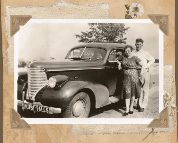 Scrapbook photo of vintage car with Ruby Falls bumper tag