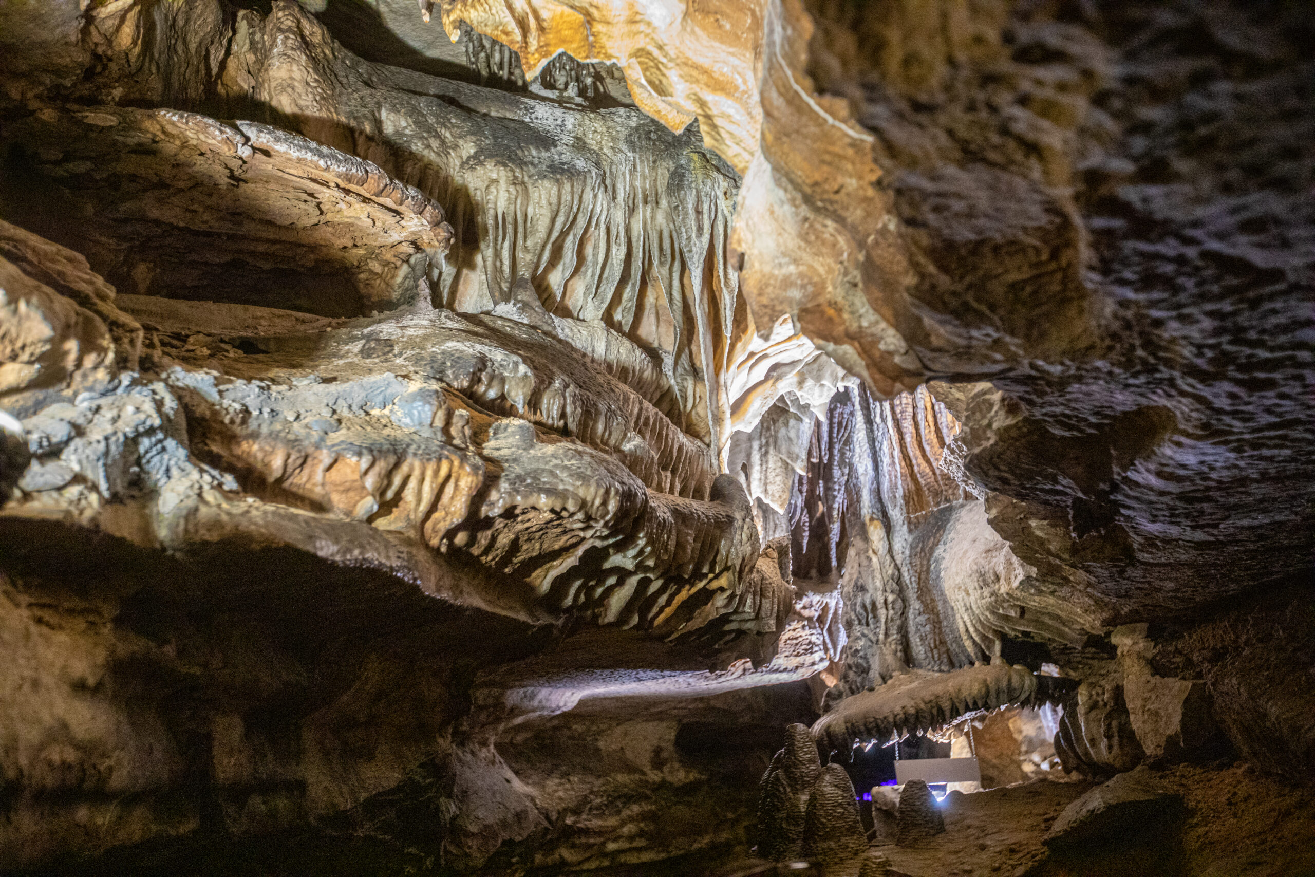 Geological formations hang from the ceiling in Ruby Falls Cave